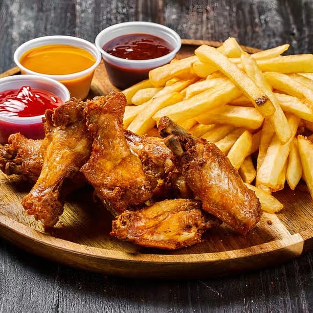 Chicken Wings with French Fries.